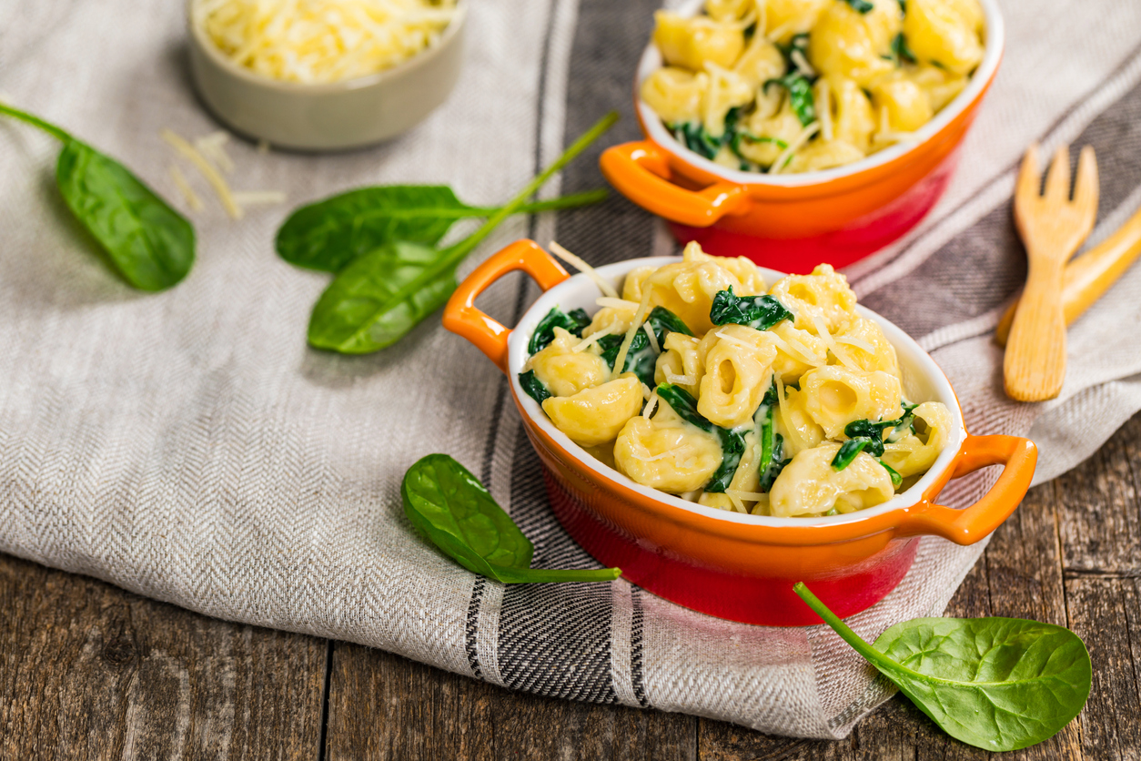 Spinach Mac and Cheese on Wooden Background