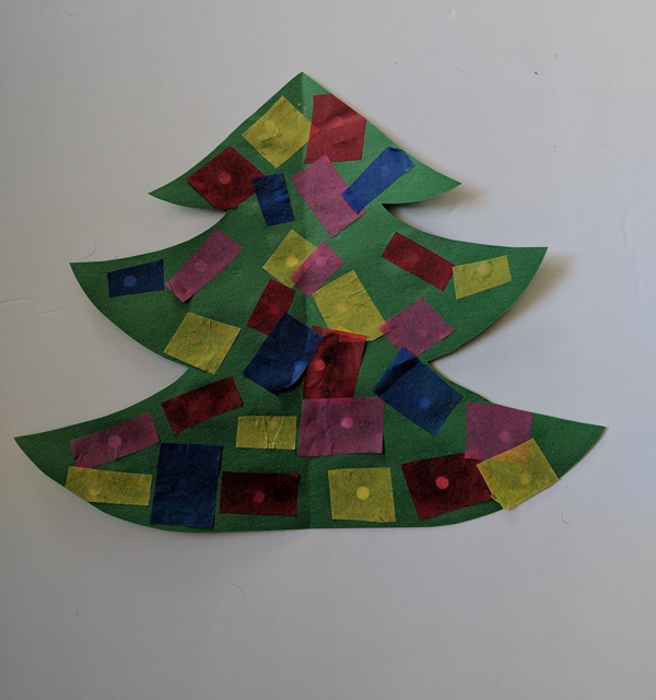 Reverse side of Paper Christmas Tree Craft with pasted tissue pieces 