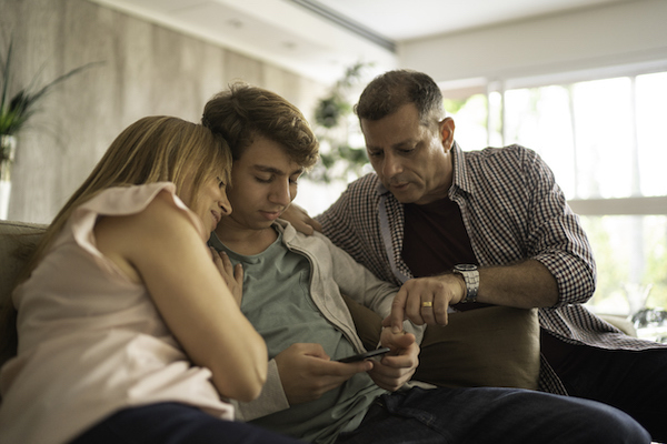 Parents explaining family rules about sexting and dating