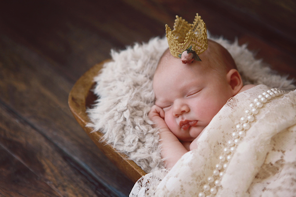 Sleeping baby with royal name and crown