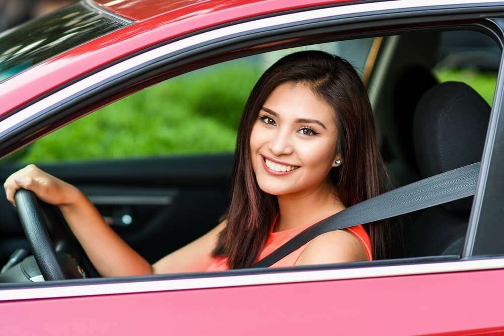 Smiling Teen Girl in Driver's Seat