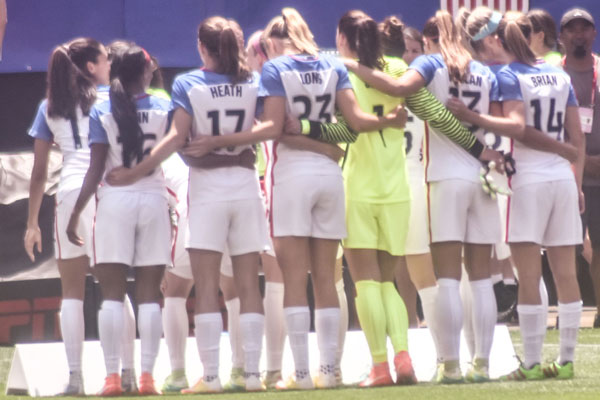 USWNT linking arms in friendship
