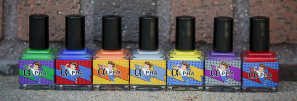 A row of Alpha Kids nail polish bottles