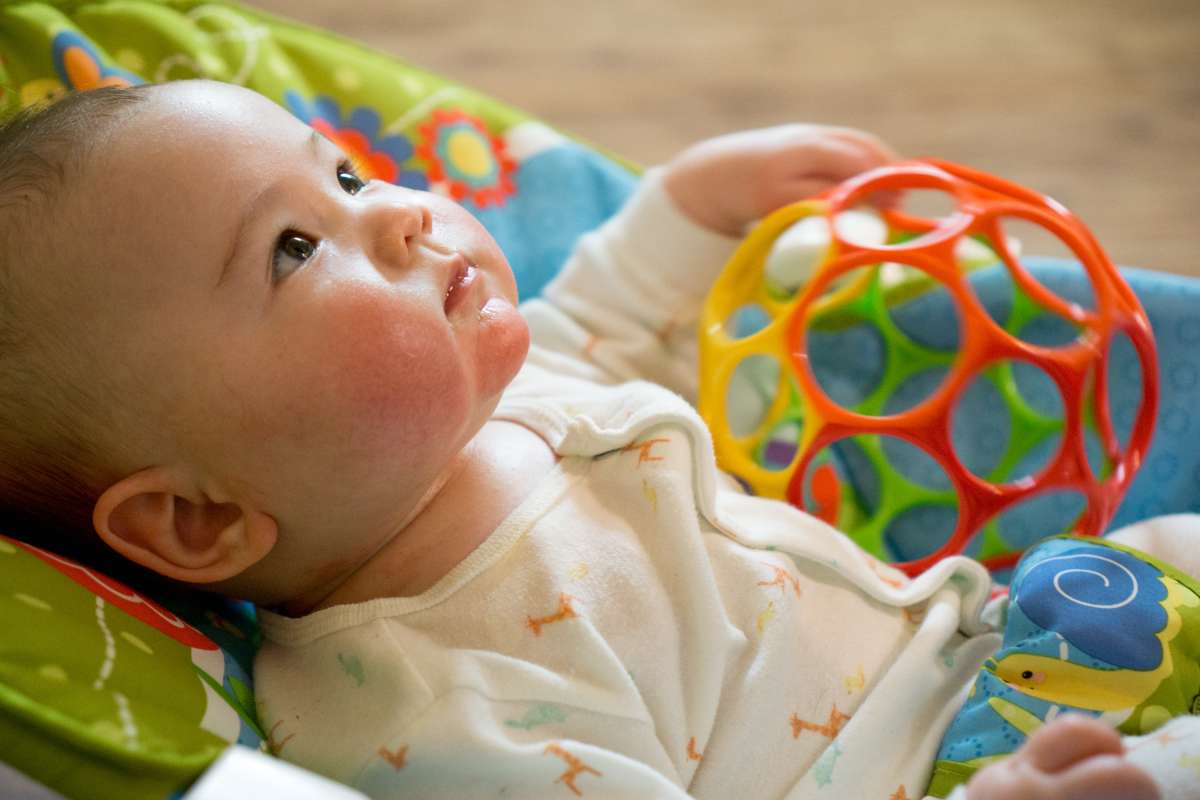 Distract your baby with a toy to help wean them