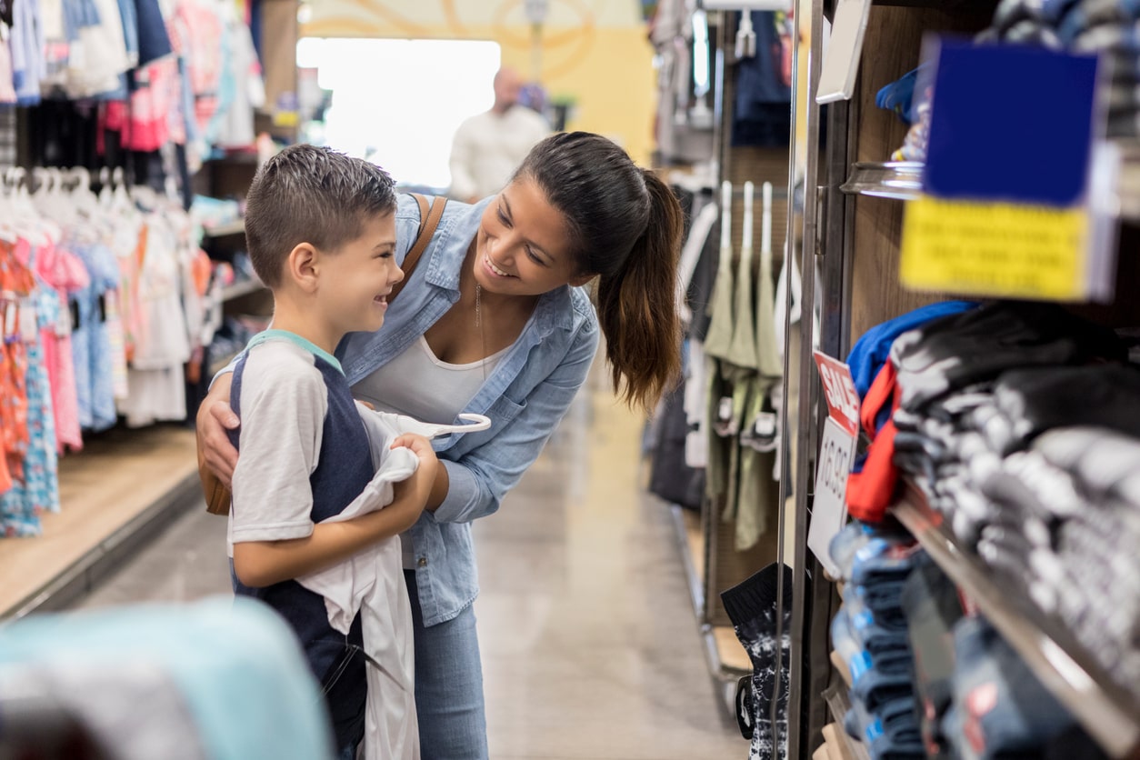 Mother and son back to school shopping for new clothes