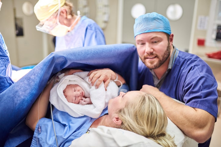 Shot of a young couple welcoming their newly born baby girl in the hospital