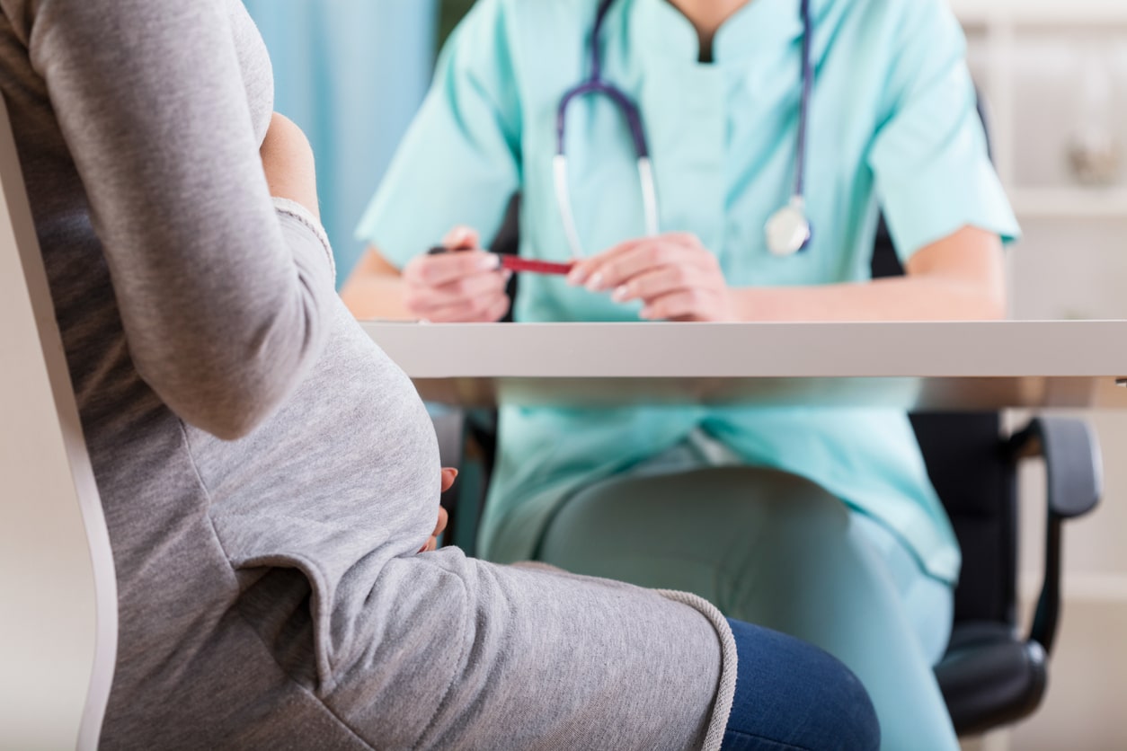 Pregnant woman at the doctor's office for suspected vaginal infection