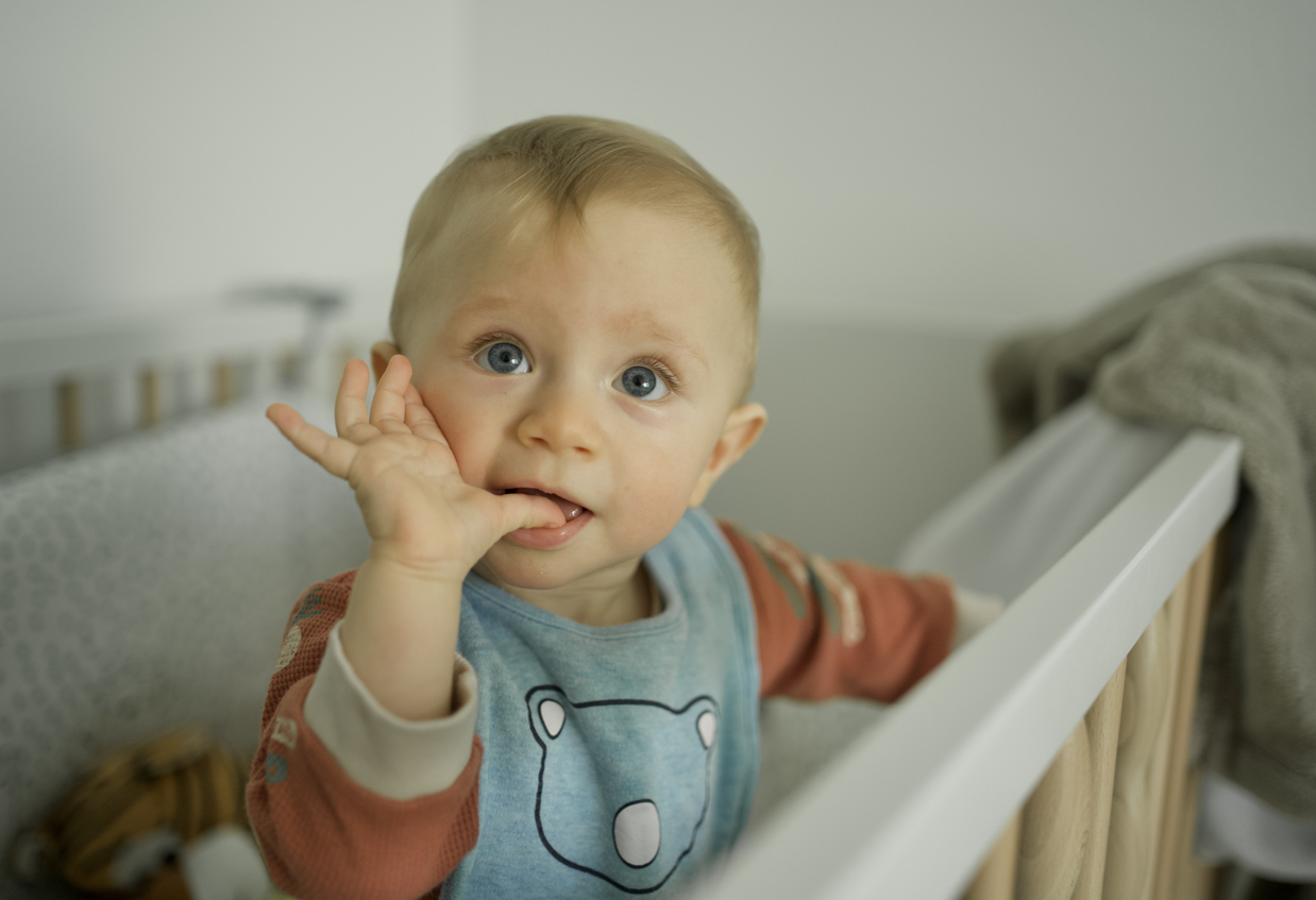 Portrait of infant sucking thumb stock photo