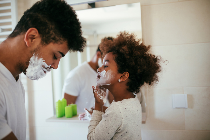 dad and daughter in bathroom shaving