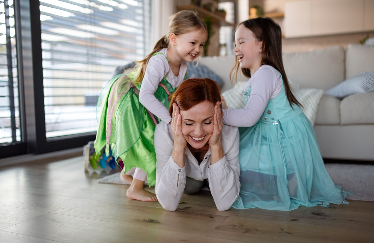 Mother and two young daughters dress as Disney princesses for Halloween 2023