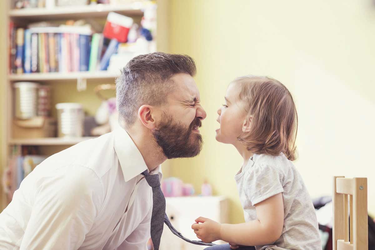 hipster dad and young toddler girl playing