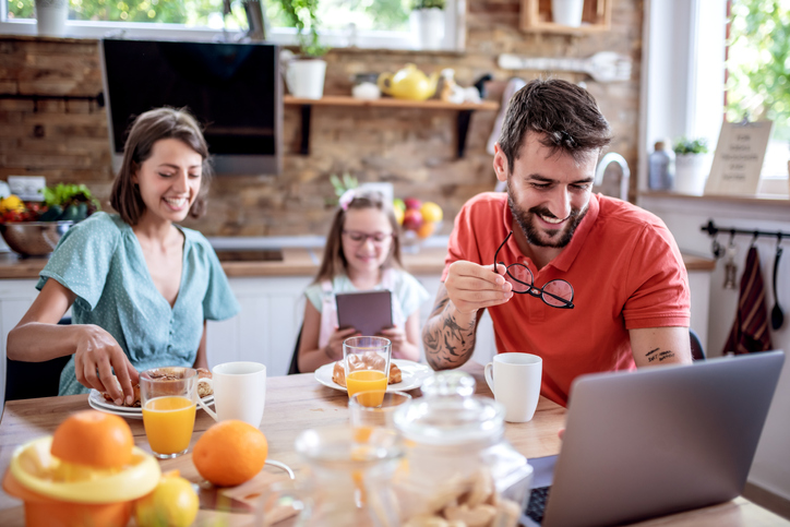 a family having breakfast over zoom 