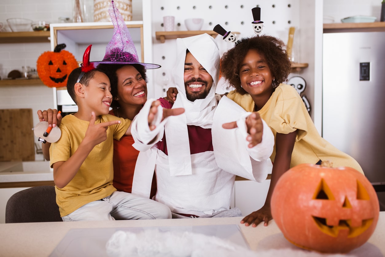 Family dresses up in group halloween costume for 4 people