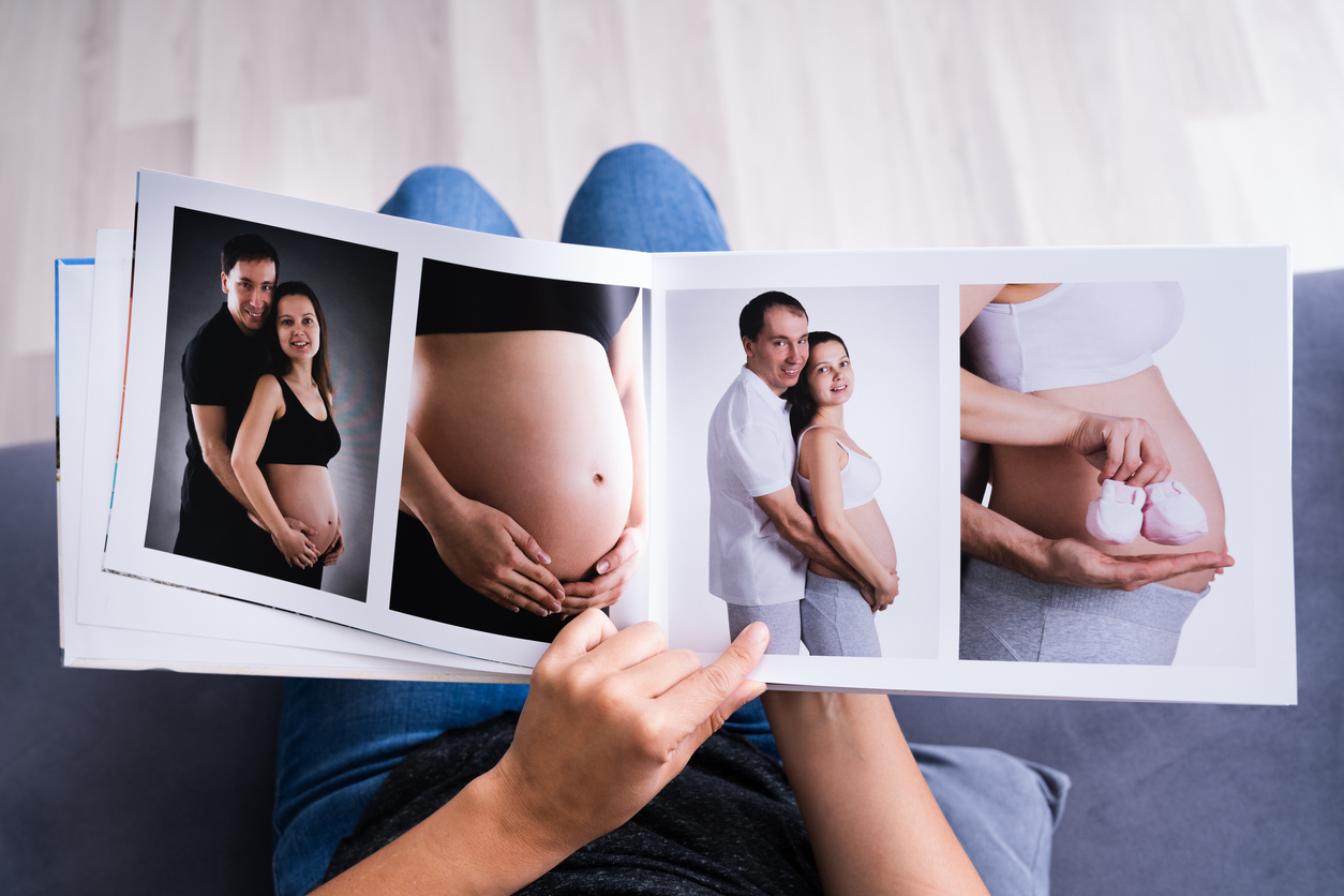 Woman Looking At Photo Album 