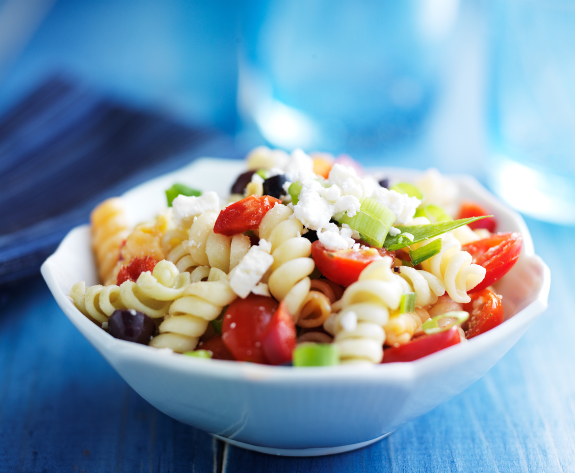 Pasta salad with olives and feta cheese stock photo