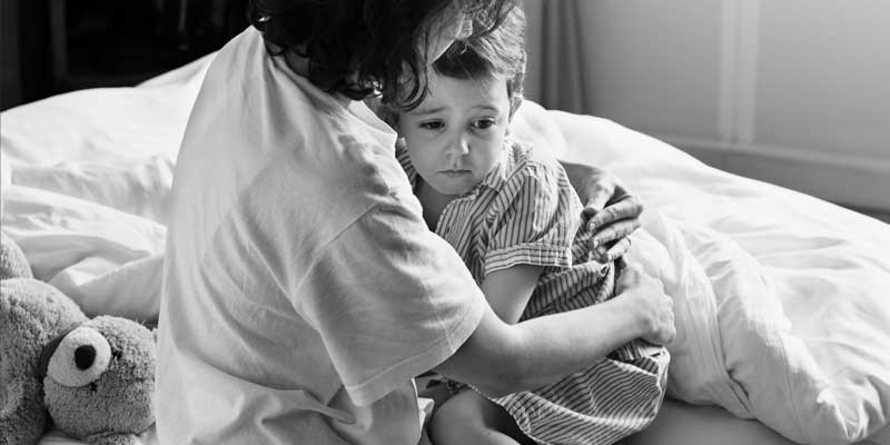 mom consoling boy from nightmare