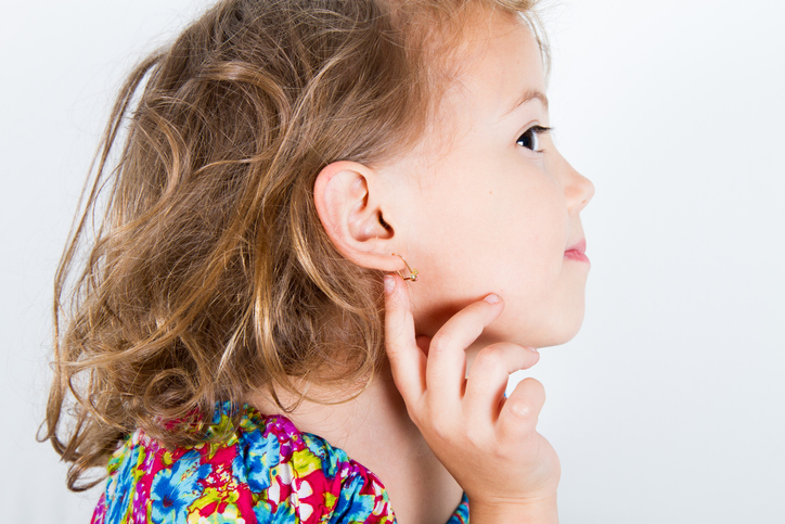 little girl with pierced ears and hoop earings 