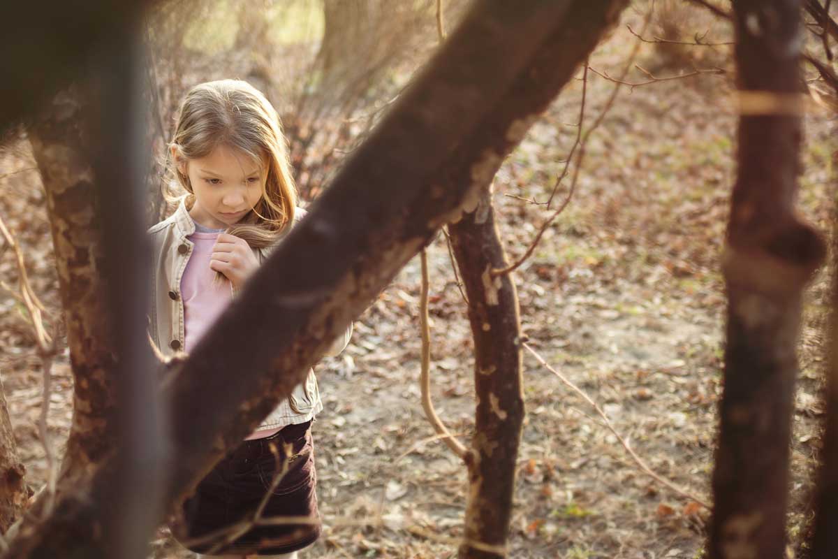 shy girl in tree