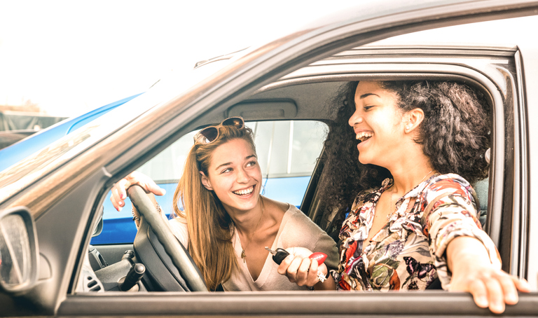 teen girls driving in a car