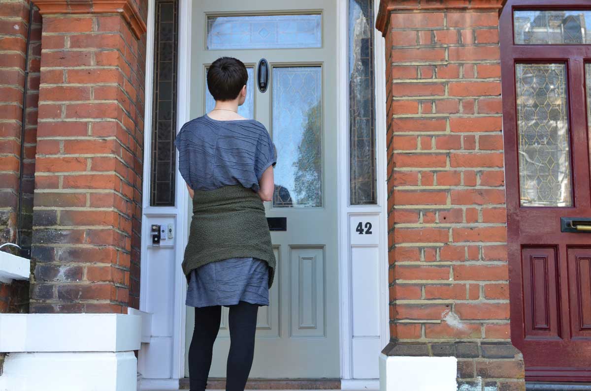 young woman canvassing at door
