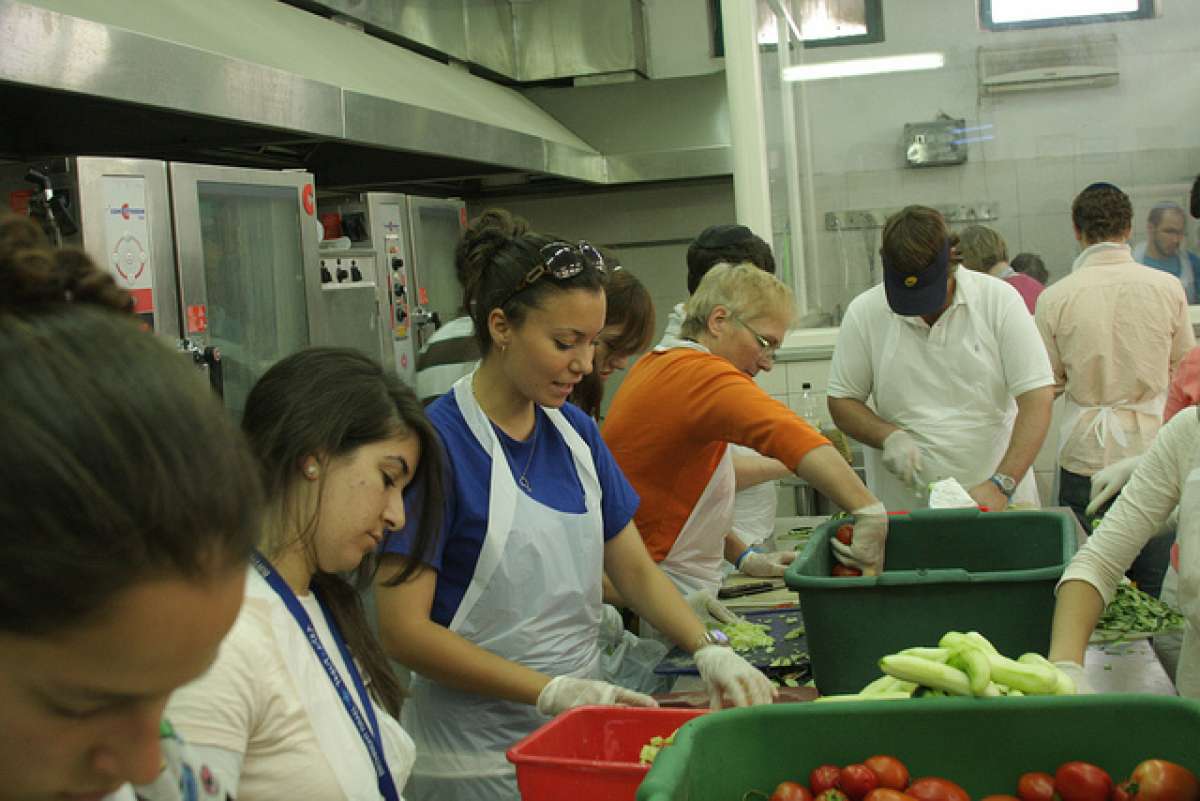 teens volunteering in soup kitchen