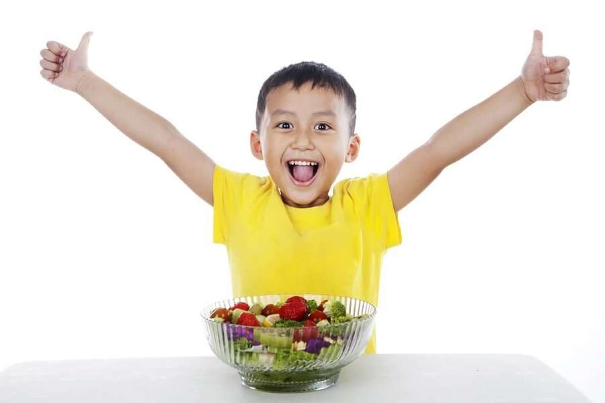 Happy Child Eating Salad
