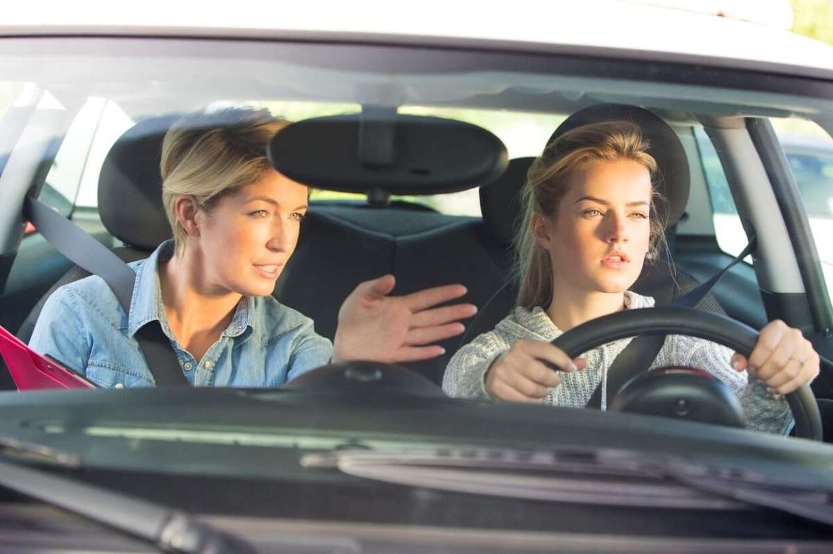 Teen Girl Learning to Drive with Mother
