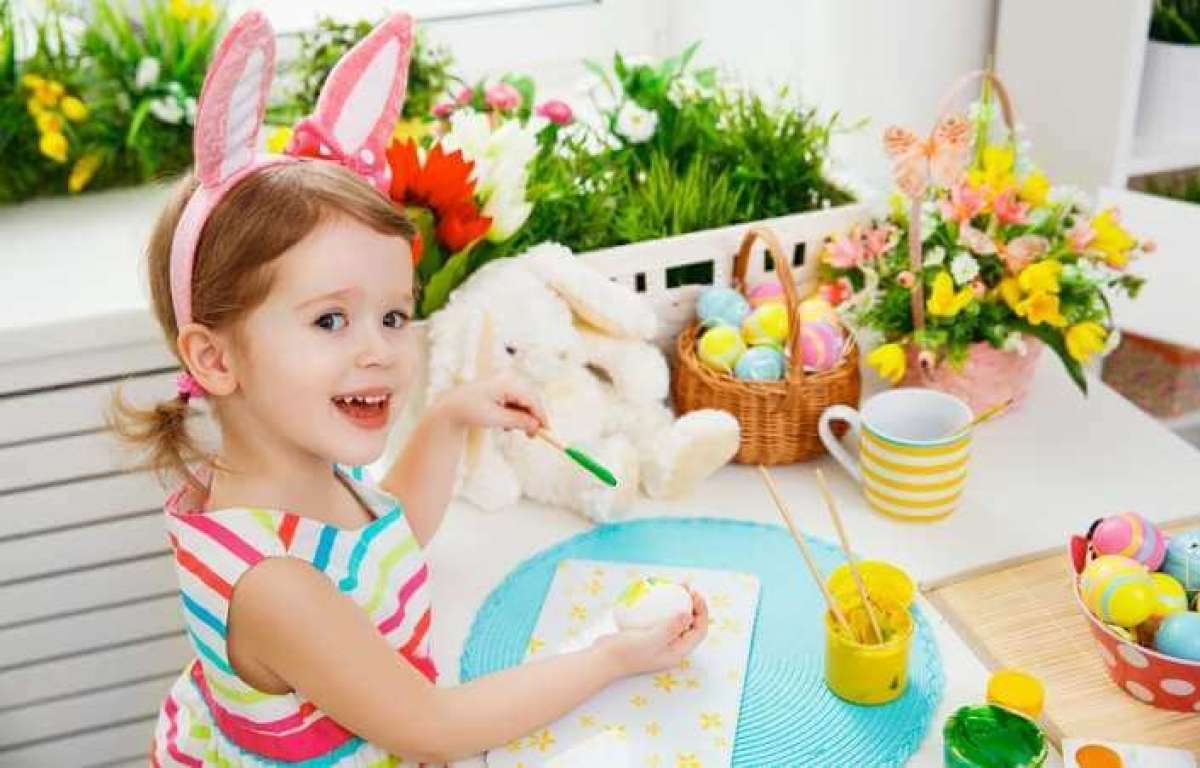 Litle Girl Wearing Bunny Ears Painting Easter Eggs