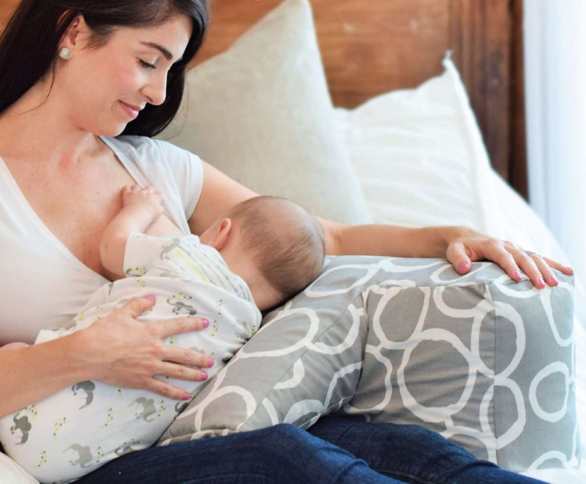 Nursing Mom Using Breastfeeding Pillow