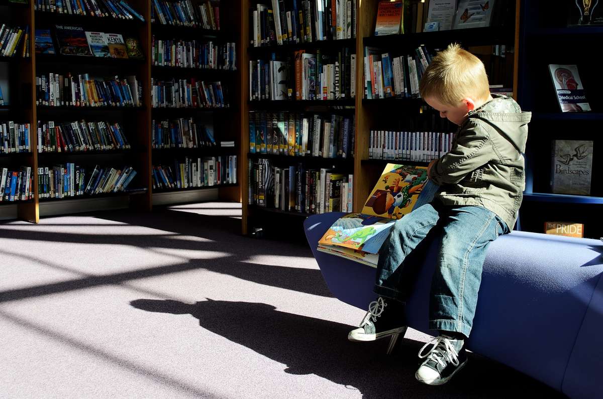 A boy reading during Get Caught Reading Month