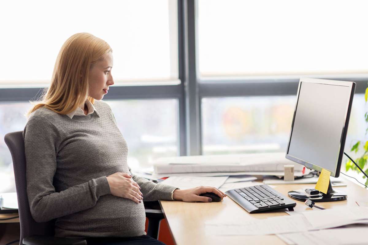 Woman in office learning about maternity leave