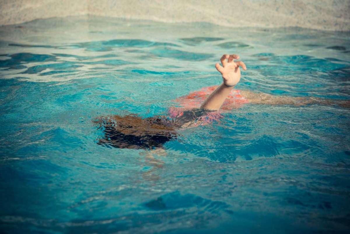 young girl swimming underwater