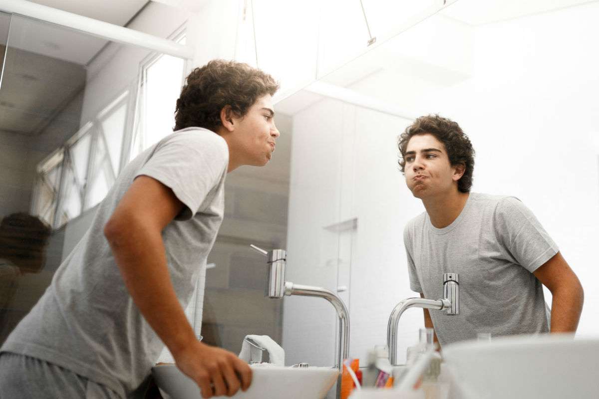 teen boy in bathroom 
