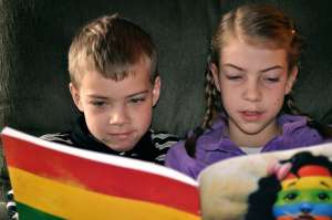Two Kids Reading a Book