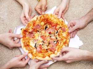Teens Sharing Take Out Pizza