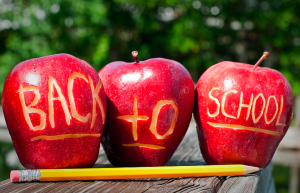 back to school gadgets - apple with back to school sign