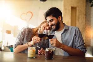 couple on valentines day saying cheers with wine