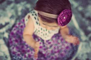 baby wearing purple outfit and diy headband
