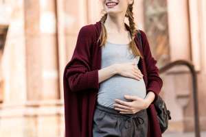 pregnant woman wearing maternity wardrobe staples