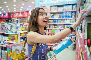 woman shopping for top toys for kids