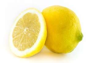 One Whole and One Half Lemon on White Background