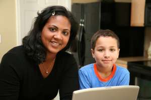 ADHD tips for parents, mother and son using laptop