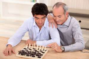 Father and son playing chess