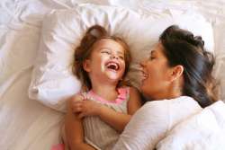 kid and mom laughing and goofing around