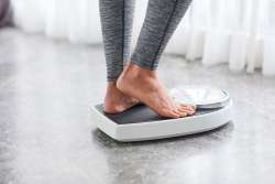 woman standing on scale