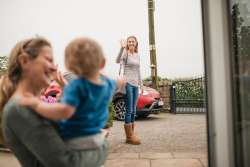 mom leaving child with babysitter