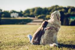 Girl hugging her dog