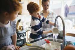 young boy doing after school chores