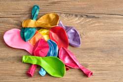 Use balloons to play indoor baseball