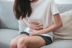 girl with stomach cramps